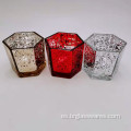 Portavelas de cristal en forma hexagonal con diferentes colores